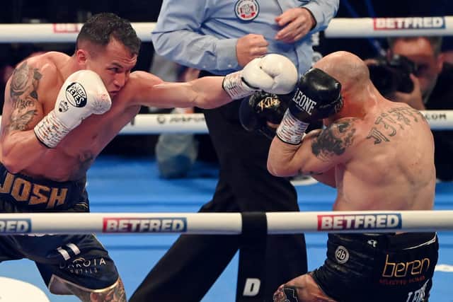 LEEDS, ENGLAND - MARCH 26: Josh Warrington (L) punches Kiko Martinez during the IBF World Featherweight Title fight between Kiko Martinez and Josh Warrington at First Direct Arena on March 26, 2022 in Leeds, England. (Photo by Stu Forster/Getty Images)