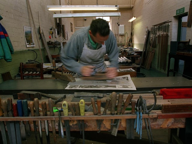 Organ pipe making at  F.J. Rogers of Bramley in August 1998. Pictured is Steve Parker planing a sheet of metal.