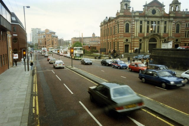 Looking west along The Headrow, towards Westgate, which begins after the junction with Oxford Place, located in front of Oxford Place Chapel which dominates the right-hand side of the image. This is now known as the Oxford Place Methodist Centre. To the left of it, between the junctions of Oxford Row and Park Street is Leeds Combined Court Centre. The red brick building with large glass windows at the junction with Park Street and Park Lane is the Magistrates Court. Behind it the 1966 high rise residential block, Marlborough Towers is visible.