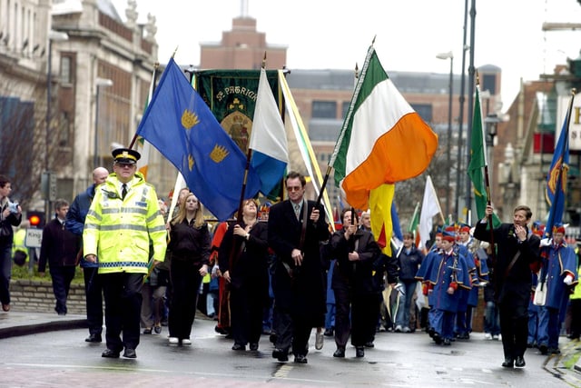 St Patricks Day Parade through Leeds city centre, on Sunday, March 14, 2004. Pictured (Centre) William Mullan carrying one of the many flags as the parade makes it's way along The Headrow.