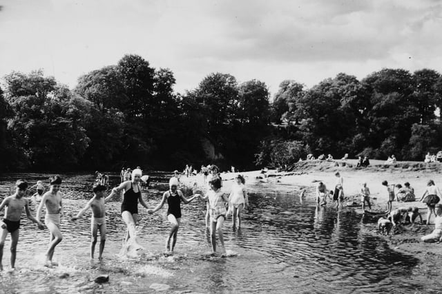 Children play in the rover at Bolton Abbey in August 1960.