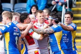 An early scuffle between Leeds Rhinos' James Bentley and Arthur Romano of Catalans Dragons in Saturday's fiery game at AMT Headingley.