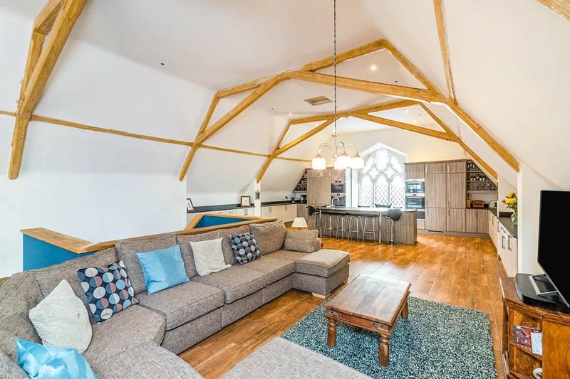 Lound Hall's open plan design is enhanced by high ceilings and original feature roof beams.