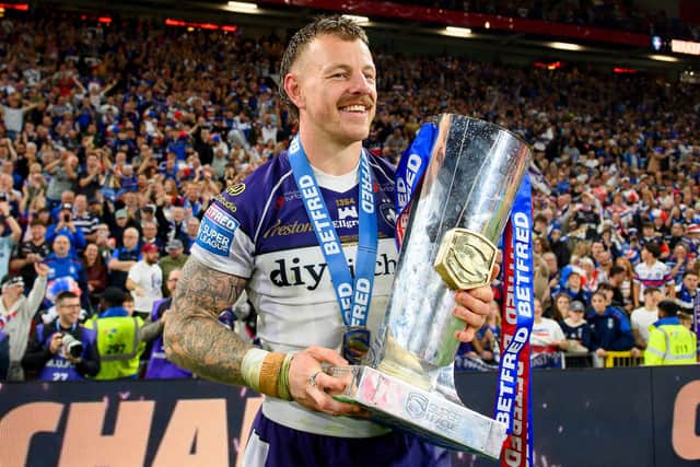 Wakefield Trinity's Grand Final man of the match Tom Johnstone, seen with the Super League trophy, has withdrawn from England contention because of injury. Picture by Allan McKenzie/SWpix.com.