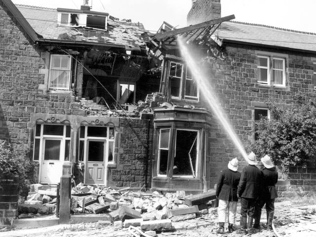 Firefighters ensure a fire is out after a gas explosion in July 1970. This house on Spring Wood Road in Rawdon was badly damaged. Fortunately it was empty at the time.