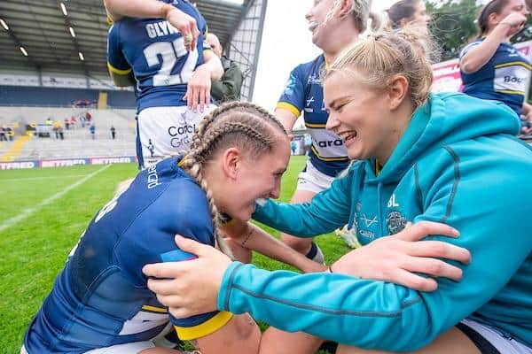Beth Lockwood, right, congratulates Caitlin Beevers after Rhinos' semi-final win over Wigan. Picture by Allan McKenzie/SWpix.com.