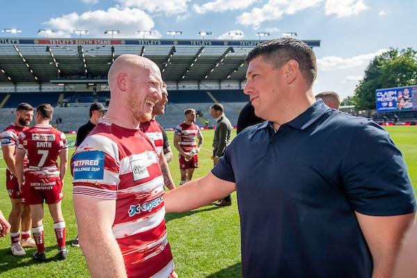 Second in the table, Wigan - whose veteran forward Liam Farrell is pictured with coach Matt Peet - are joint second-favourites to win at Old Trafford.