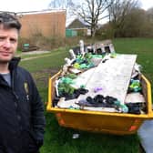 Carl Thewlis, Chairman of Moortown Rugby Club by the skip at the back of the rugby club loaded with dog poo bags. Photo: Steve Riding