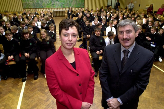 Pupils at Crawshaw High School, Pudsey, Leeds, returned on September 6, 2001 for the first time after the school was badly-damaged by the fire. Pictured left, Tracey Coy, head of year and Nigel Turner, headteacher, with Year 7 pupils looking on.