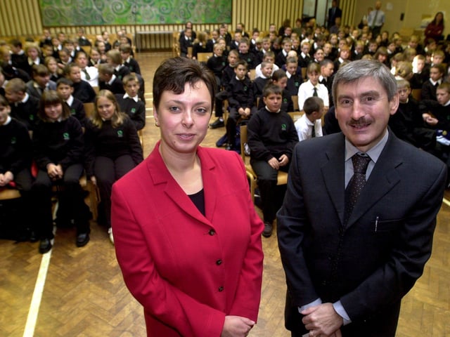 Pupils at Crawshaw High School, Pudsey, Leeds, returned on September 6, 2001 for the first time after the school was badly-damaged by the fire. Pictured left, Tracey Coy, head of year and Nigel Turner, headteacher, with Year 7 pupils looking on.