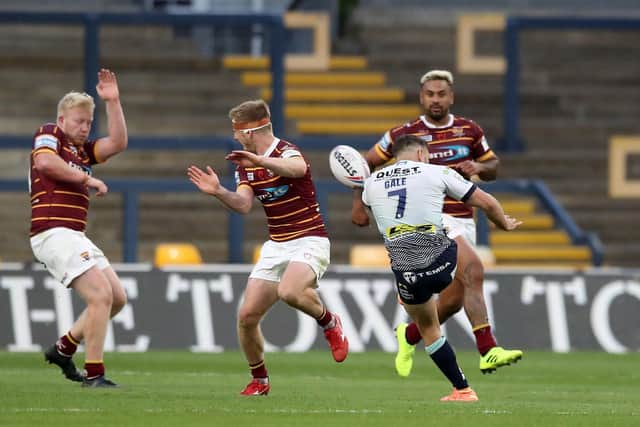 Luke Gale kicks a golden-point winning drop goal for Rhinos against Huddersfield in 2020. Picture by Martin Rickett/PA Wire.