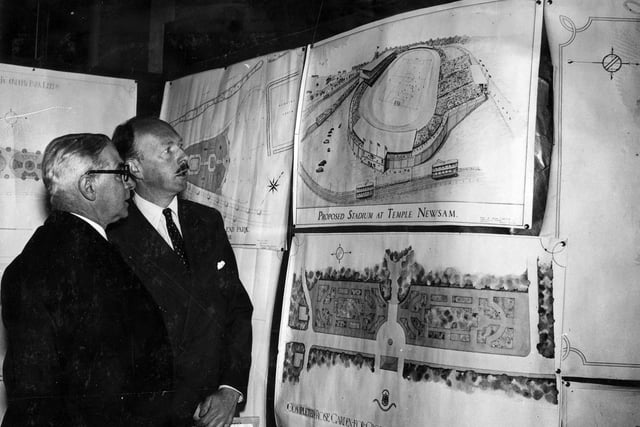 The Institute of Park Adminstration Conference held at Leeds Town Hall. The Rt.Hon. The Earl of Huntingdon, Parliamentary Secretary, Ministry of Agriculture, and Alderman Alf Masser, Deputy Chairman of the Parks Committee of Leeds City Council, are inspecting a display of plans including a proposed stadium for Temple Newsam, and the completed Rose Garden at Cross Gates Recreation Ground.