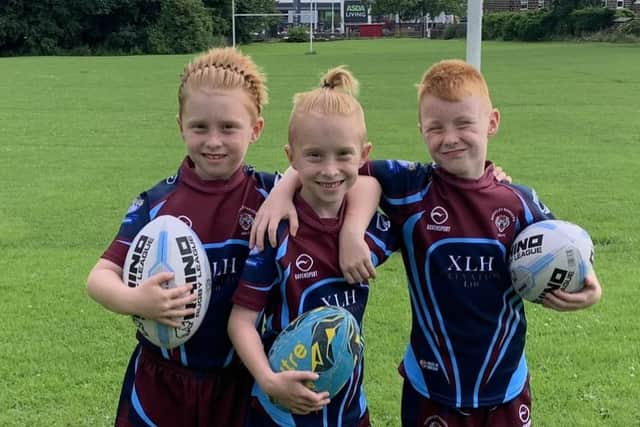 Triplets Harrison, Leo and Xander Oliver who will celebrate their 10th birthday by playing together for Guiseley Rangers on the Headingley pitch at half-time of Leeds Rhinos' Super League clash with St Helens. Picture by Rose Oliver.