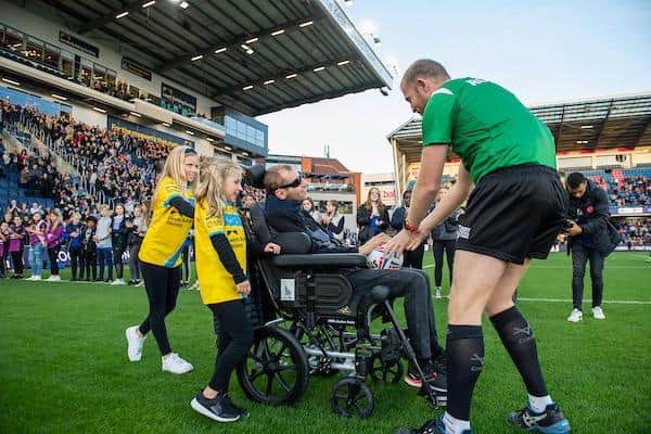 Rhinos legend Rob Burrow delivers the match ball to referee Robert Hicks ahead of the game against New Zealand. Picture by Allan McKenzie/SWpix.com.