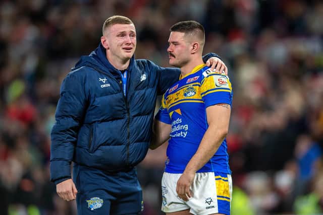 An upset Harry Newman, left, with James Bentley on the pitch at Old Trafford after the 2022 Grand Final. (Picture by Bruce Rollinson)