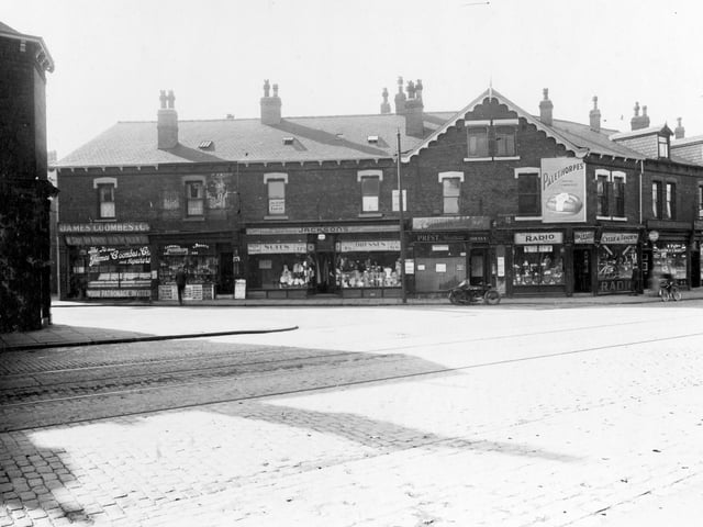 Roundhay Road and Bayswater Road, to the left, in September 1936. Number 8 premises of James Coombes and Co, boot and shoe repairs. Moving right, number 6 Alfred Hunt, newsagent. Number 4, branch of Jackson's Tailors. Next, at number 2 Albert Edward Prest, hairdresser. Numbering now changes to Roundhay Road, number 114, Butler's cycle and radio dealers (owners H and H Wilbert). Then number 112 Roland Usher, sweet shop, last, 110 Arthur Winterbottom chemist.