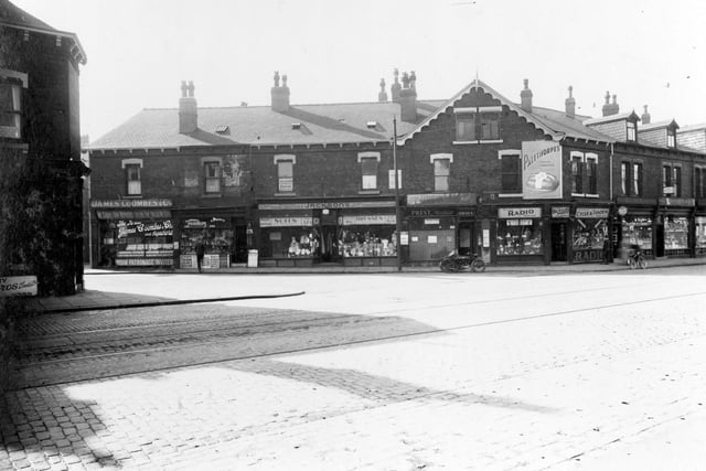 Roundhay Road and Bayswater Road, to the left, in September 1936. Number 8 premises of James Coombes and Co, boot and shoe repairs. Moving right, number 6 Alfred Hunt, newsagent. Number 4, branch of Jackson's Tailors. Next, at number 2 Albert Edward Prest, hairdresser. Numbering now changes to Roundhay Road, number 114, Butler's cycle and radio dealers (owners H and H Wilbert). Then number 112 Roland Usher, sweet shop, last, 110 Arthur Winterbottom chemist.