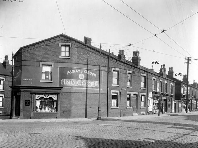 The corner of Compton Road and Stanley Road in September 1935. No 2 Stanley Road is a corner shop belonging to proprietor and grocer Arthur Smith. An advert for Ind Coope is painted on the side of the building. Along Compton Road are Howard Binks, hairdresser; Compton Fisheries; Arthur Pullan Newsagent and others not identifiable.