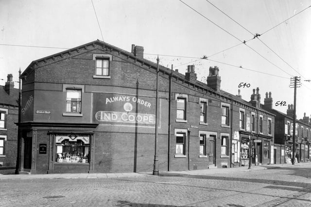 The corner of Compton Road and Stanley Road in September 1935. No 2 Stanley Road is a corner shop belonging to proprietor and grocer Arthur Smith. An advert for Ind Coope is painted on the side of the building. Along Compton Road are Howard Binks, hairdresser; Compton Fisheries; Arthur Pullan Newsagent and others not identifiable.
