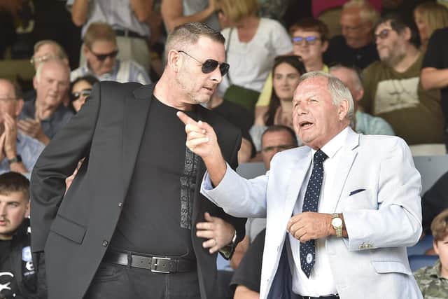 Posh chairman Darragh MacAnthony (left)cwith director of football Barry Fry.