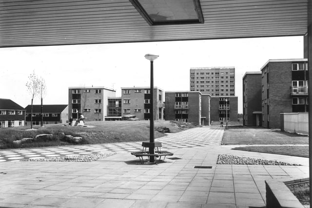 A view from Ash Tree Grange, a block of high rise flats on the Swarcliffe estate. Various examples of council housing are visible including houses, maisonettes and tower blocks. Ash Tree Grange was built to a height of 36 metres on 12 floors in 1965.