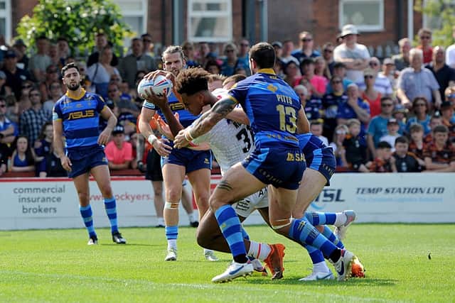 Leon Ruan smashes his way over the line to score a try on his Rhinos debut, against Wakefield. Picture by Simon Hulme.