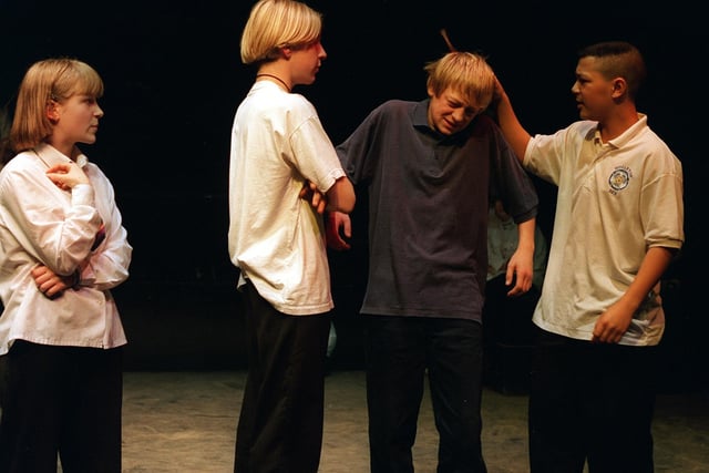 Ghost In My Dreams performed by pupils at Middleton Park High School in December 1996. Zoe Smith watches helplessly as fellow victim, Jamie Brown is bullied by Shane Platts (left) and Simon Allotey. The pupils, all aged 15 at the time, used their own names in the play.