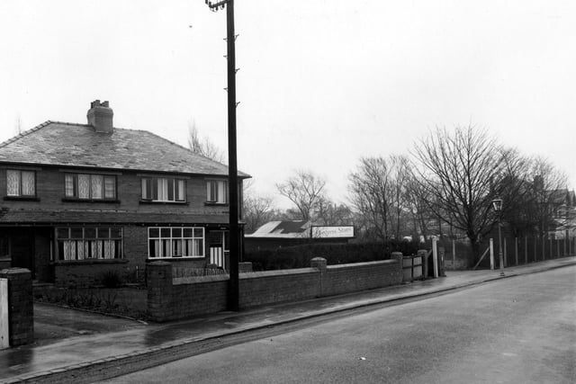 The east side of King Lane in January 1955. A pair of semi-detached houses on the left. The roof and sign of Progress Stores are visible.
