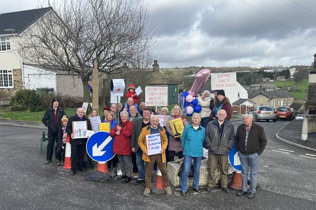 Residents of Wyke Lane want the Oakenshaw Cross to be repaired and returned.