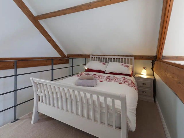 Large glass panels act as walls in each of the bedrooms, keeping out noise from downstairs.