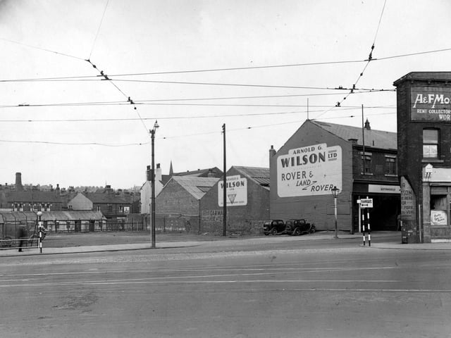 Chapeltown Road at junction with Sheepscar Street North in July 1957. Meanwood Road in background. 'Arnold Wilson's Garage' and 'Mosley's Rent Collectors' visible.