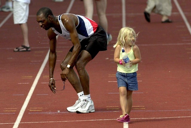 A little girl cools an athlete off during the British Transplant Games held at South Leeds Stadium.