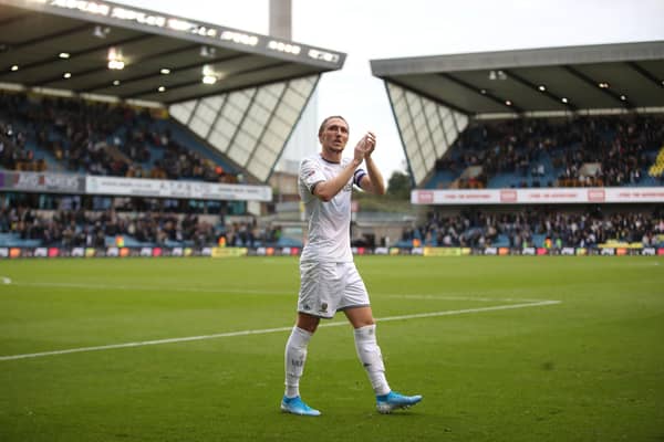 SELL-OUT: Leeds United's clash against Millwall at The Den, above, Whites defender Luke Ayling pictured applauding the club's travelling fans after the 2-1 defeat of 
October 2019 in the club's last visit there. Photo by Christopher Lee/Getty Images.