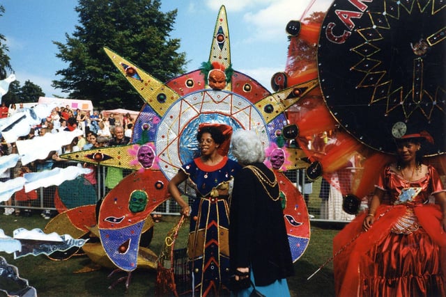 Some of the colourfully dressed participants at the Leeds West Indian Carnival at Potternewton Park in August 1997, talking to the Lord Mayor of Leeds, Councillor Linda Middleton. This colourful spectacle of costumes, music and dance of Caribbean origin is the oldest West Indian carnival in the country, having taken place at the August Bank Holiday every year since 1967, and it is second only to Notting Hill in size.