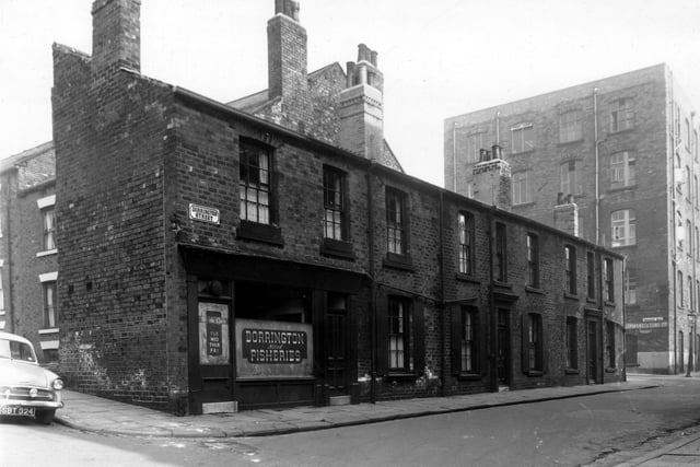 Carlton Terrace is on left on Dorrington Street number 1 is a fish and chip shop. This was the business of Robert Tingle, moving right are 3 then 5 at the corner with Dorrington Road. The factory building on the right is Camrass and Sons Ltd, clothing manufacturers, Dorrington Road Mills. Pictured in August 1959.