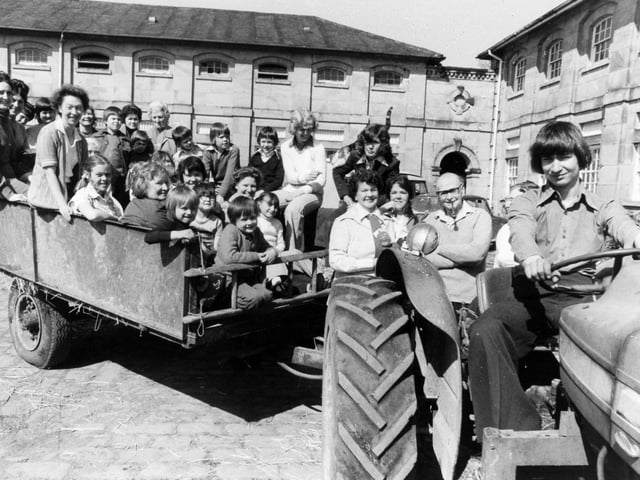 EP Women's Circle members and their children had fun down on the farm when they visited Swillington House Farm in April 1976.  Driving the tractor is James Bulloack, whose father owns the farm.
