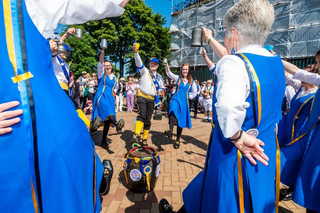 Morris dancers get people in the mood for an afternoon of beer drinking. Picture By Yorkshire Post Photographer,  James Hardisty. Date: 3rd June 2023.