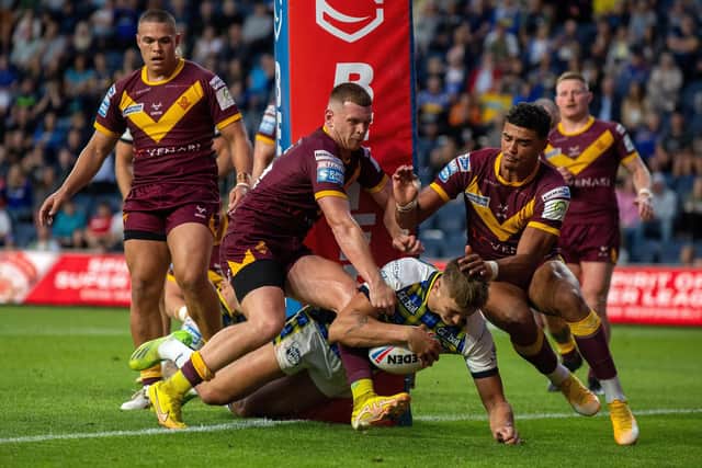 Sam Lisone's contract extension was a boost for Rhinos after another prop Sam Walters, pictured scoring against Huddersfield, confirmed he will join Wigan next year.  Picture by Bruce Rollinson.