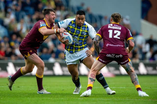 Sam Lisone on the charge for Rhinos against Huddersfield. Picture by Bruce Rollinson.