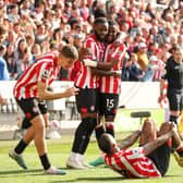 HELPING HAND: From Brentford as the Bees celebrate Josh Dasilva's winner. Photo by Ryan Pierse/Getty Images.