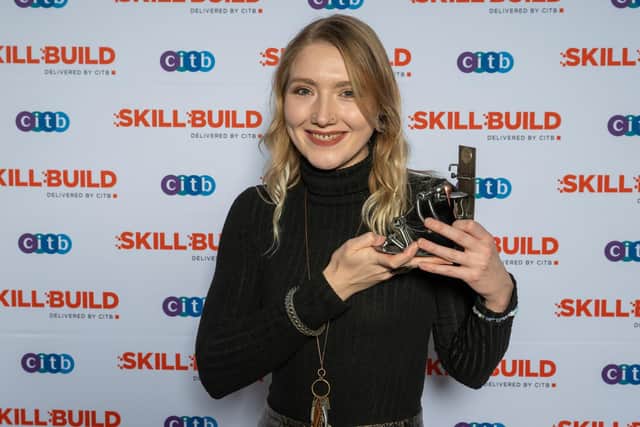 Holly Taylor Whitehead wins first place in the tiling final of SkillBuild 2024.