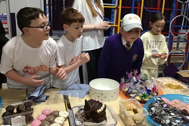 Young bakers Lola, Ted, Isaac and Charlie at their charity stall.