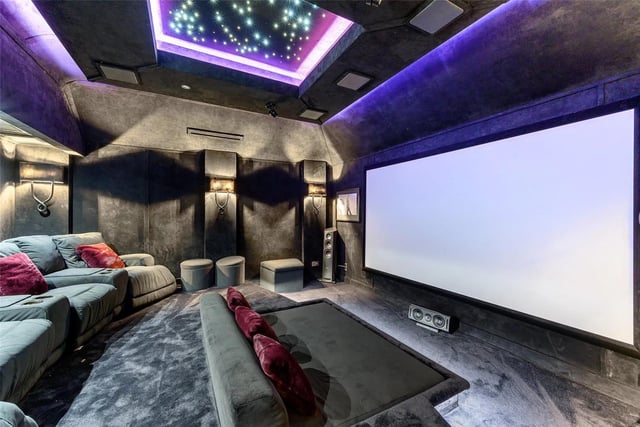 The separate bar area offers concealed access into the sumptuous cinema room.
