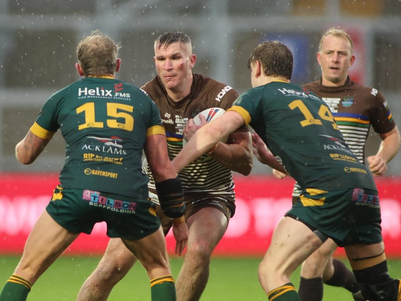 Ben Shulver runs at the West Hull defence during Hunslet ARLFC's 14-0 win in the National League Premier Division Grand Final at storm-lashed Wakefield Trinity.
