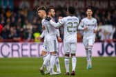 BREAKTHROUGH: Jack Harrison, centre, celebrates firing Leeds United ahead at Accrington. Picture by Bruce Rollinson.
