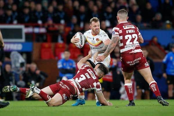 Tom Johnstone is tackled during Catalans Dragons' defeat by Wigan Warriors in last month's Super League Grand Final. Picture by Ed Sykes/SWpix.com.
