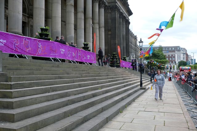 Leeds Town Hall decked out with banners and bunting on the morning of the Olympic torch relay. The Olympic flame was to be carried through the streets of Leeds before progressing to Morley and then the district of Wakefield. Although it was not due to commence its journey until 7.17 am the crowds had begun gathering from around 6.30 am to witness the occasion.