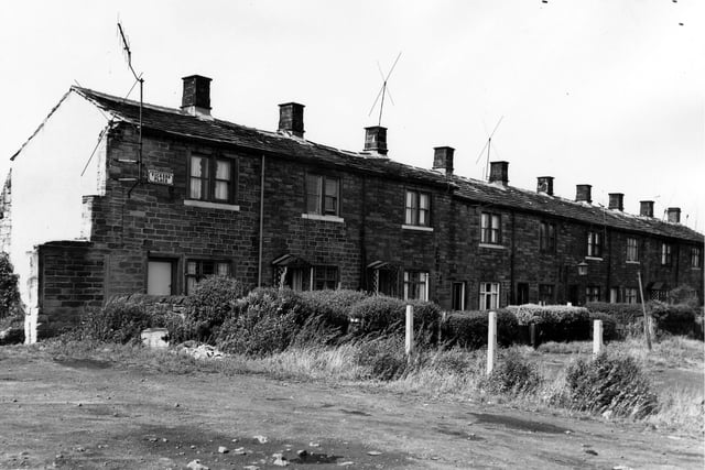 A row of through by light terraced houses each with a private front garden. Behind here stood the Vickersdale Engineering Works now cleared.