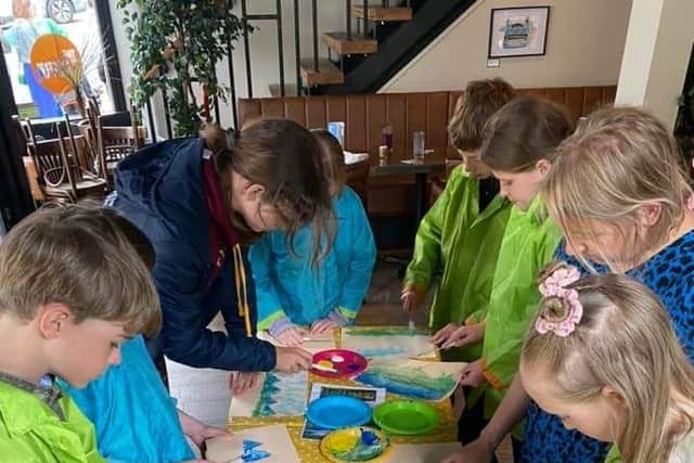 All ages getting stuck in to mindful art with artist Helen Earnshaw at The Tavern.