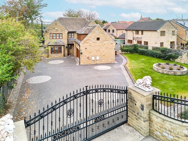 The property has branded iron gates that lead into an expansive courtyard drive, offering ample off-street parking in addition to a double garage.